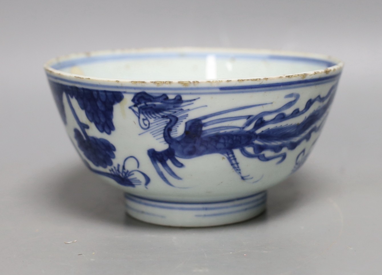 A Chinese blue and white ‘phoenix’ deep bowl, 17th century, 15.5cm